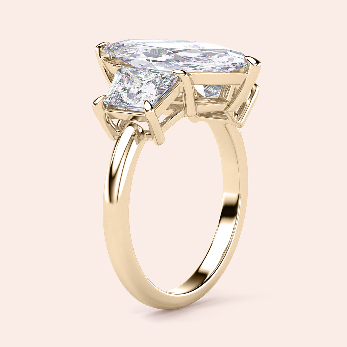 "Elegant yellow gold engagement ring featuring jade marquise and three stone trapezoid design, available in 14K or 18K."
