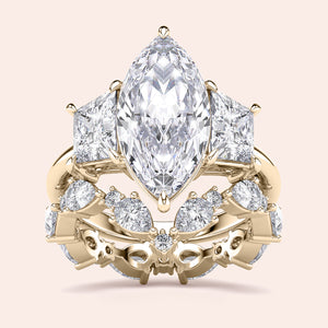 Radiant cut diamond engagement ring in 14K yellow gold with split-shank design and round diamond accents for a stunning look.