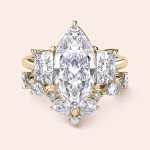 Radiant cut diamond engagement ring in 14K yellow gold with split-shank design and round diamond accents for a stunning look.