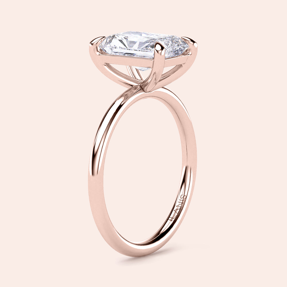 Elegant 14K rose gold engagement ring with an elongated cushion diamond in a classic solitaire design, perfect for special occasions.