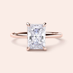 "Elegant radiant-cut diamond solitaire engagement ring in 14K rose gold, perfect for timeless romance."