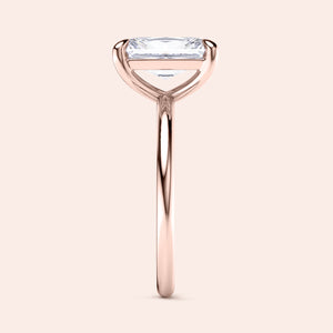 "Elegant 14K rose gold engagement ring featuring an emerald-cut diamond in a minimalist design. Perfect for special occasions."