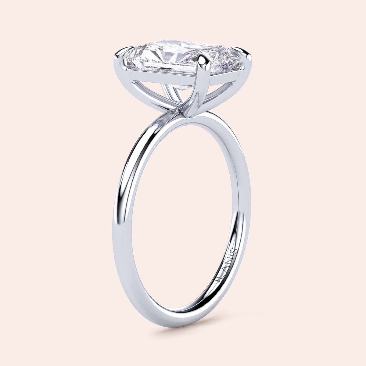 Elegant 14K or 18K white gold engagement ring featuring a striking elongated cushion-shaped diamond solitaire in a classic prong setting.