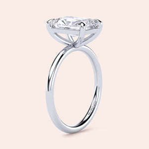 Elegant 14K or 18K white gold engagement ring featuring a striking elongated cushion-shaped diamond solitaire in a classic prong setting.