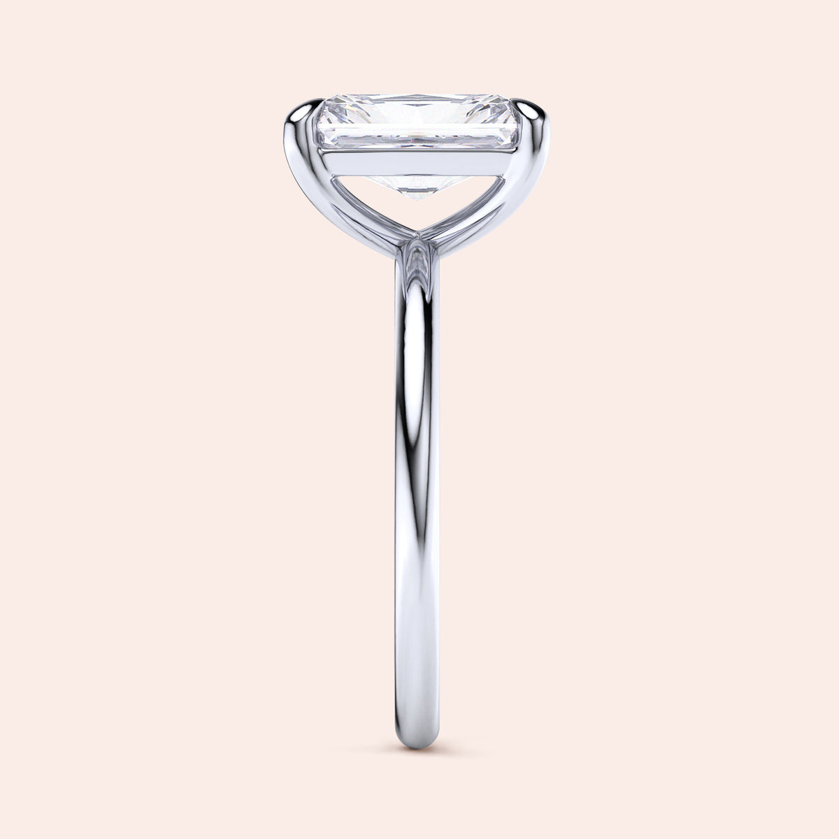 Elegant 14K and 18K white gold solitaire engagement ring with emerald-cut diamond, showcasing a sleek design.
