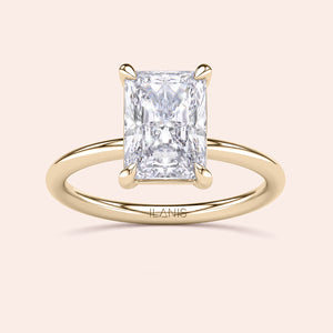 Radiant-cut diamond solitaire ring in 14K yellow gold, a timeless engagement choice for modern brides.