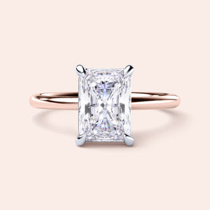 Two-tone 14K/18K white and rose gold ring featuring a radiant-cut diamond in a classic solitaire design. 