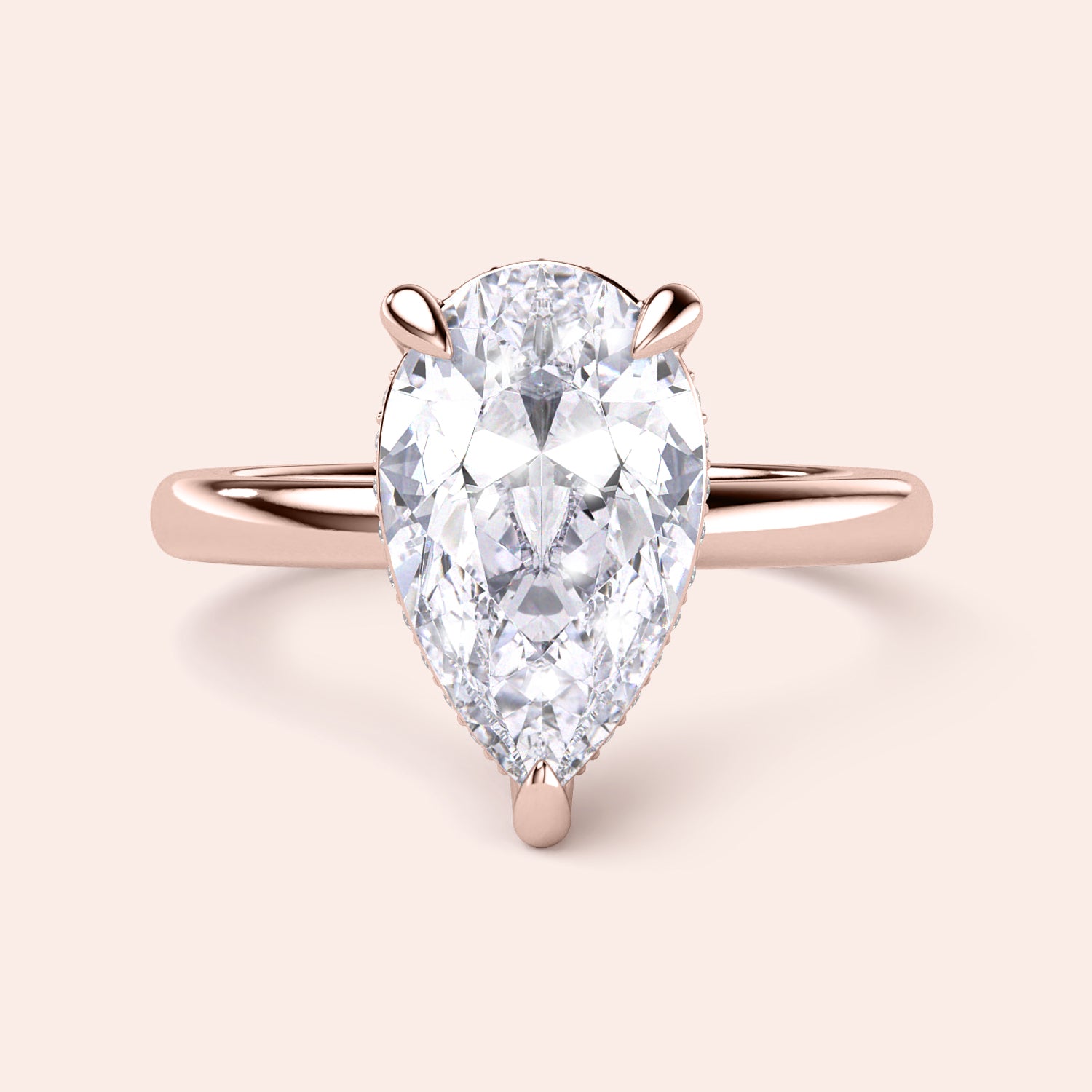 Elegant pear-shaped diamond engagement ring in rose gold, available in 14K, 18K, or platinum; perfect for special occasions. 


#14KRecycledRoseGold
#18KRecycledRoseGold


