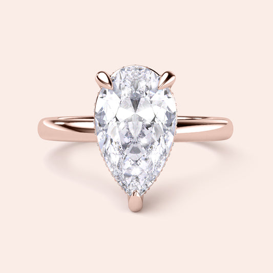 Elegant pear-shaped diamond engagement ring in rose gold, available in 14K, 18K, or platinum; perfect for special occasions. 


#14KRecycledRoseGold
#18KRecycledRoseGold


