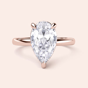 Elegant pear-shaped diamond engagement ring in rose gold, available in 14K, 18K, or platinum; perfect for special occasions. 


#14KRecycledRoseGold
#18KRecycledRoseGold


