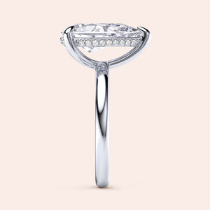 Close-up side view of a white gold engagement ring featuring a marquise-cut diamond andPave diamonds, available in 14K and 18K. 