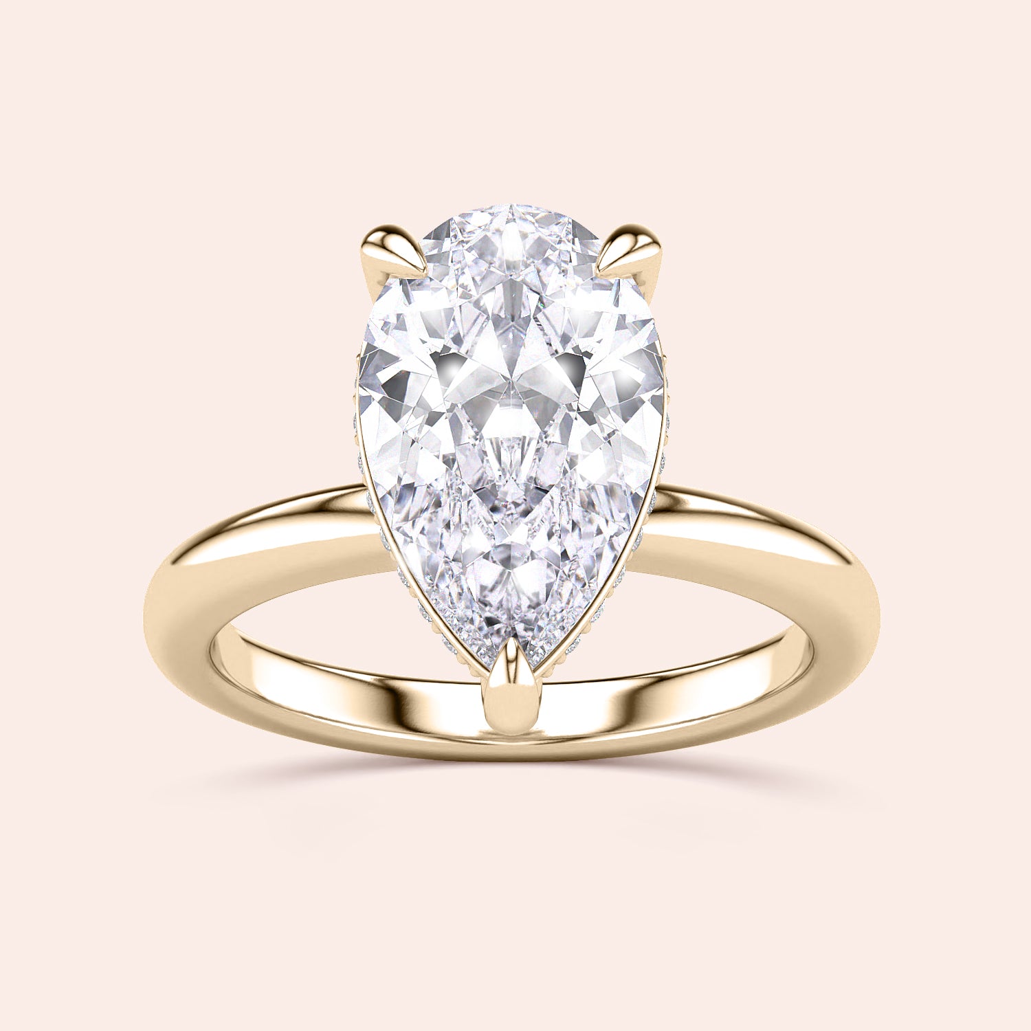 Elegant pear-shaped diamond ring in 14K or 18K yellow gold, featuring a hidden halo and plain band, radiating timeless beauty. |




#14KRecycledYellowGold
#18KRecycledYellowGold






