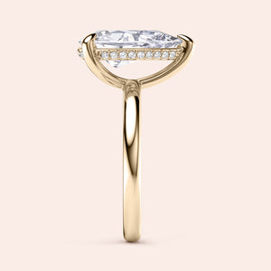 Elegant pear-shaped diamond engagement ring in 14K and 18K gold or platinum, featuring a hidden halo and sleek band. 