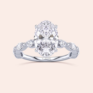 Elegant 14K white gold engagement ring featuring an oval diamond and round diamonds on the band for timeless sophistication.