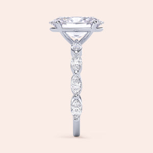 Side profile of a 14K gold engagement ring with a marquise-cut diamond and diamond accents, elegantly designed for timeless beauty.