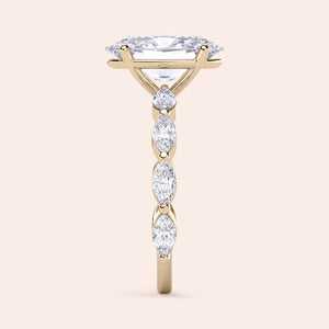 14K gold engagement ring with marquise-shaped diamond and side stones, elegantly designed for a timeless appeal.
