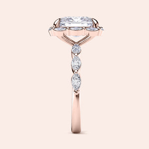 Elegant rose gold engagement ring with radiant-cut diamond and marquise side stones, available in 14K, 18K, or platinum.