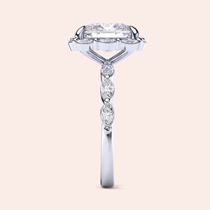 Elegant 14K white gold women's engagement ring with radiant cut diamond and marquise side stones, perfect for timeless romance.