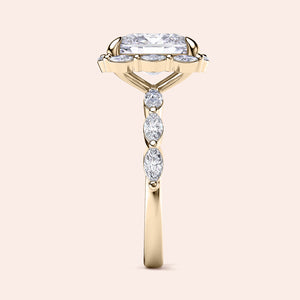 Elegant 14K yellow gold engagement ring with radiant cut diamond center and marquise accents, displayed without a model.