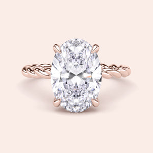 Elegant 14K rose gold oval twisted band ring featuring a dazzling diamond solitaire, perfect for engagement or special occasions.