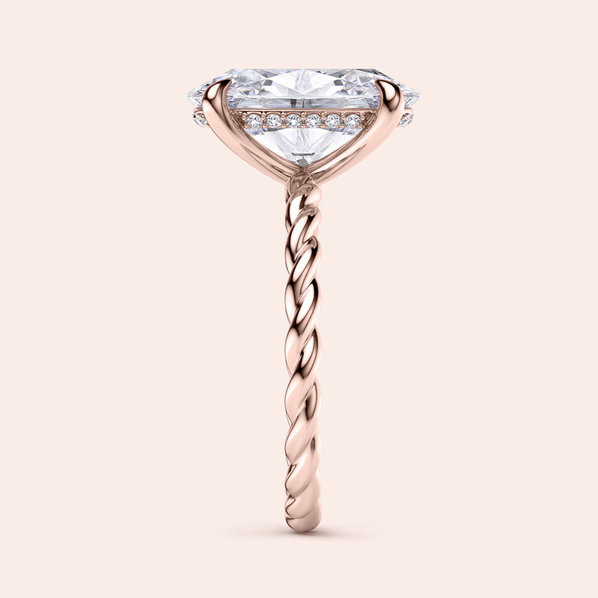 Elegant 14K rose gold twisted band engagement ring with an oval diamond, side view showcasing its exquisite design.