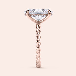 Elegant 14K rose gold twisted band engagement ring with an oval diamond, side view showcasing its exquisite design.
