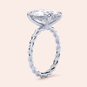 14K white gold twisted band engagement ring featuring an oval diamond andPave diamonds, perfect for elegant proposals.