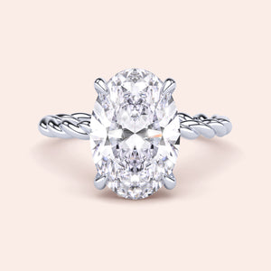 Elegant oval-shaped twisted band engagement ring in white gold, available in 14K, 18K, or platinum. Perfect for a timeless look.