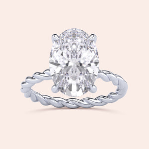 Stunning oval-shaped diamond engagement ring with a twisted band in 14K or 18K white gold or platinum.