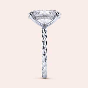 Elegant 14K or 18K white gold twisted band engagement ring featuring a diamond-shaped center stone and pave diamond accents.
