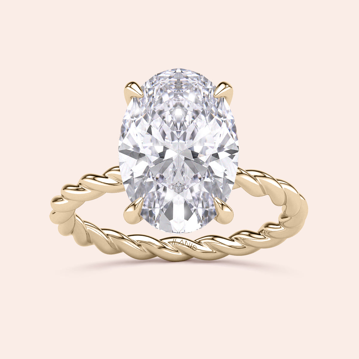 Gold twisted band ring featuring an oval-shaped diamond, available in 14K, 18K, or platinum, shown unworn.