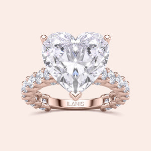 Heart-shaped diamond engagement ring in rose gold, featuring a halo of diamonds. Available in 14K, 18K, or platinum.