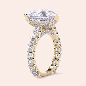 Elegant 14K or 18K yellow gold engagement ring with oval diamond center and diamond-studded band, heart-hidden halo design.
