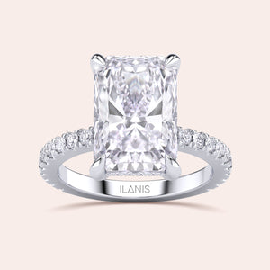 Radiant-cut diamond engagement ring in 14K or 18K white gold, showcasing a stunning pave diamond band detail.
