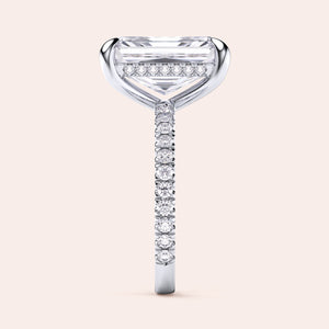 Elegant 14K/18K platinum engagement ring with emerald-cut diamond, side view showcasing a radiantPave diamond band.