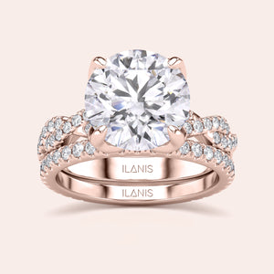 Rose gold teardrop halo engagement ring set featuring pear-shaped diamond, with options in 14K, 18K, or platinum settings.