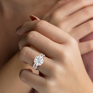 Rose gold teardrop halo engagement ring set featuring pear-shaped diamond, with options in 14K, 18K, or platinum settings.