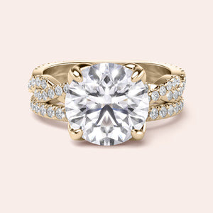 Radiant-cut diamond engagement ring with side stone accents in 14K yellow gold, displayed on a neutral background.