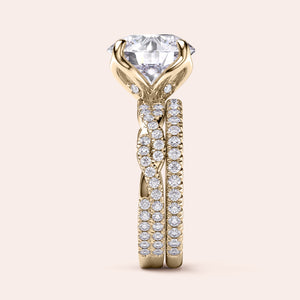 Radiant-cut diamond engagement ring with side stone accents in 14K yellow gold, displayed on a neutral background.