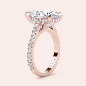 Rose gold teardrop halo engagement ring set featuring pear-shaped diamond, with options in 14K, 18K, or platinum settings.