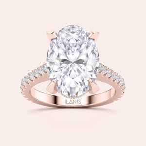 Rose gold teardrop halo engagement ring set featuring pear-shaped diamond, with options in 14K, 18K, or platinum settings.