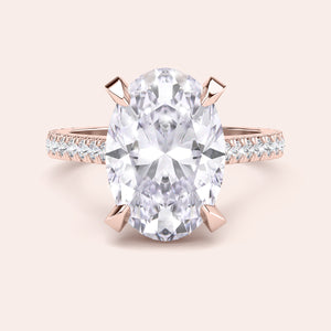 Rose gold teardrop halo engagement ring set featuring pear-shaped diamond, with options in 14K, 18K, or platinum settings.