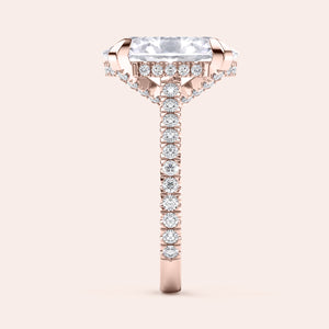Rose gold teardrop halo engagement ring set featuring pear-shaped diamond, with options in 14K, 18K, or platinum settings.