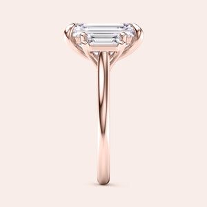 Rose gold teardrop halo engagement ring set featuring pear-shaped diamond, with options in 14K, 18K, or platinum settings.