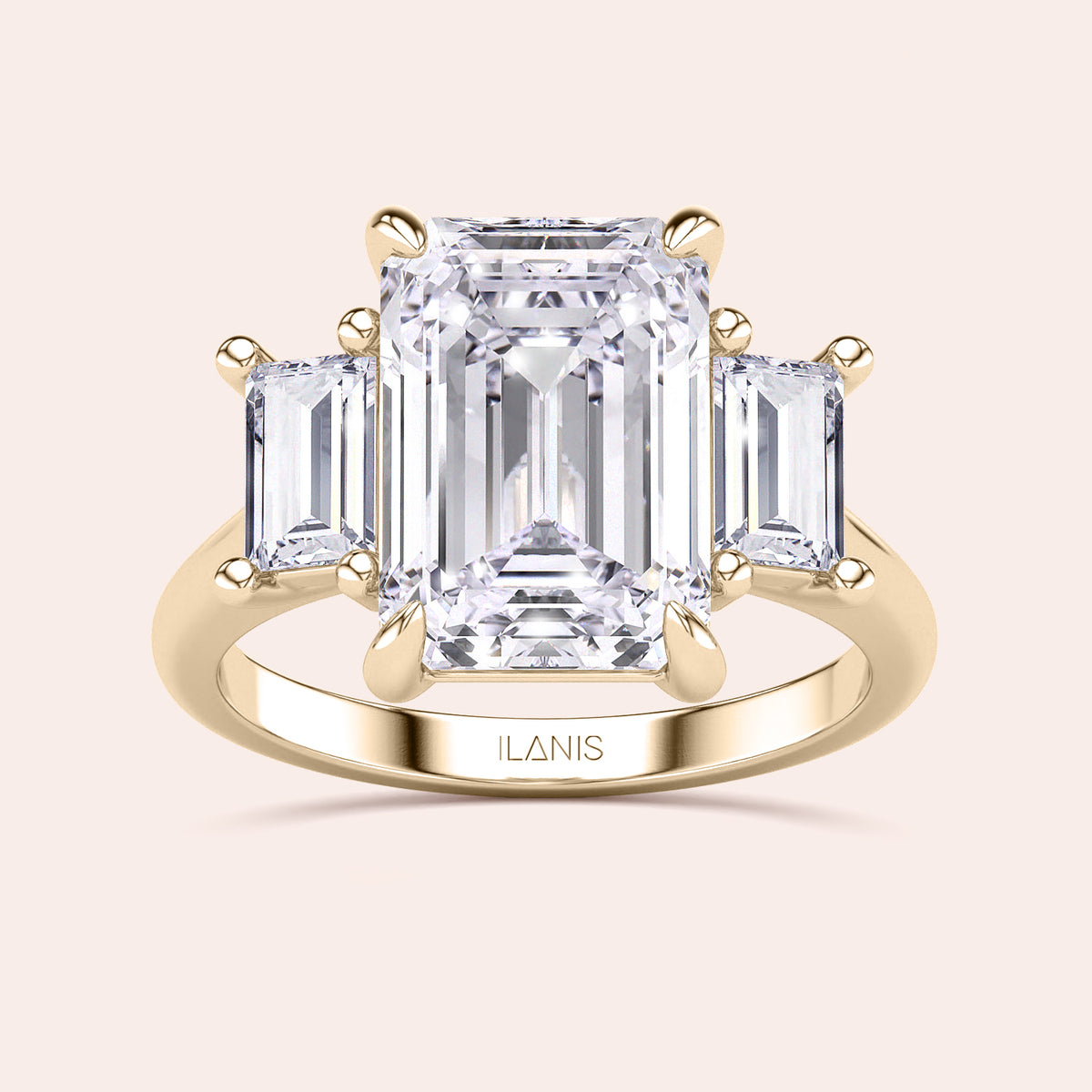 Radiant-cut diamond engagement ring with side stone accents in 14K yellow gold, displayed on a neutral background.