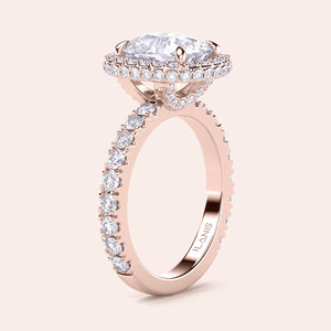Rose gold teardrop halo engagement ring set featuring pear-shaped diamond, with options in 14K, 18K, or platinum settings.
