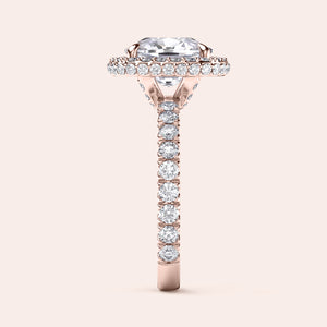 Rose gold teardrop halo engagement ring set featuring pear-shaped diamond, with options in 14K, 18K, or platinum settings.