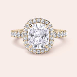 Radiant-cut diamond engagement ring with side stone accents in 14K yellow gold, displayed on a neutral background.
