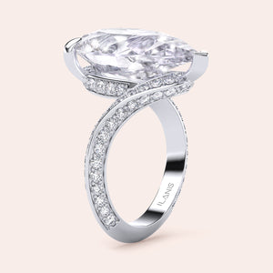 Elegant pear-shaped diamond engagement ring in 14K/18K gold or platinum, featuring a sparkling diamond-studded band.