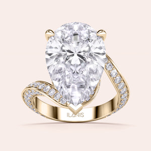 Exquisite pear-shaped diamond ring in 14K/18K gold or platinum, adorned with halo diamond accents for an elegant touch.